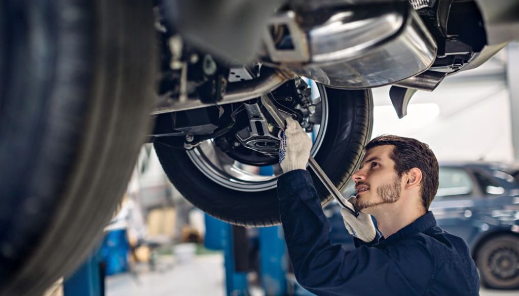 a man is working on a car in a garage